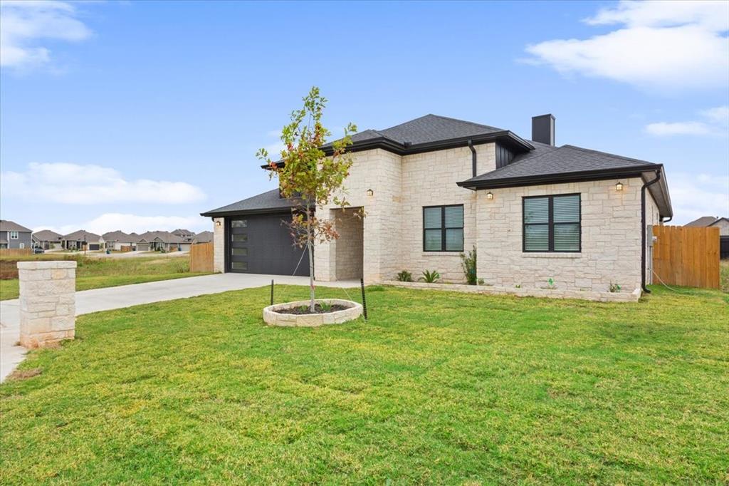 959 Gallant Fox Hewitt, TX 76643 - Photo 38 of 38 a front view of a house with garden