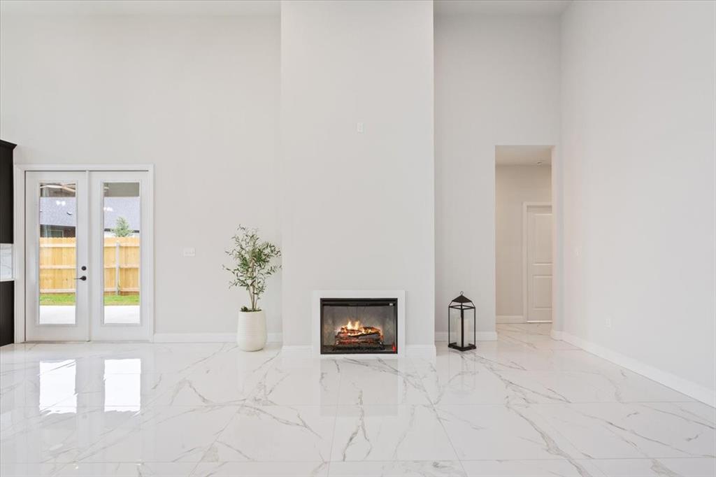 959 Gallant Fox Hewitt, TX 76643 - Photo 6 of 38 an empty room with windows and cabinet