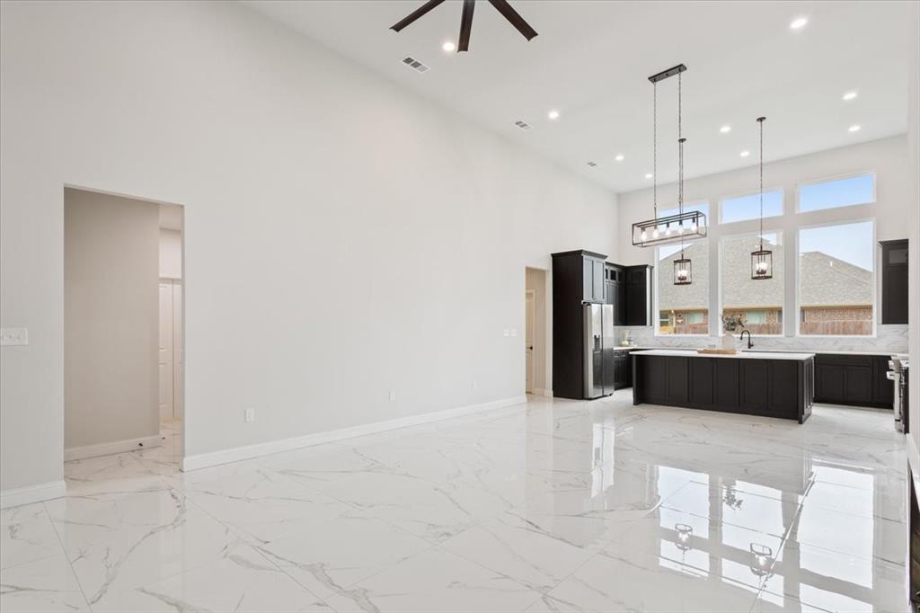 959 Gallant Fox Hewitt, TX 76643 - Photo 8 of 38 a large kitchen with a sink stainless steel appliances and cabinets