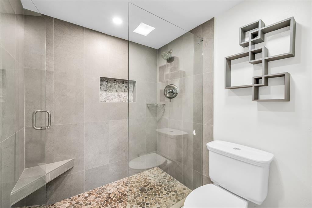 1703 Andros Isle, Unit G4 Coconut Creek, FL 33066 - Photo 12 of 33 a bathroom with a shower toilet and sink