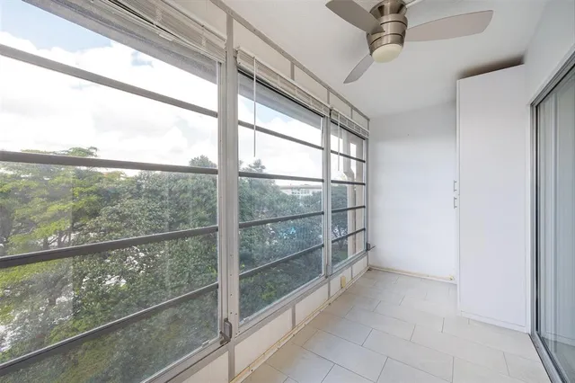 a view of a room with a large window