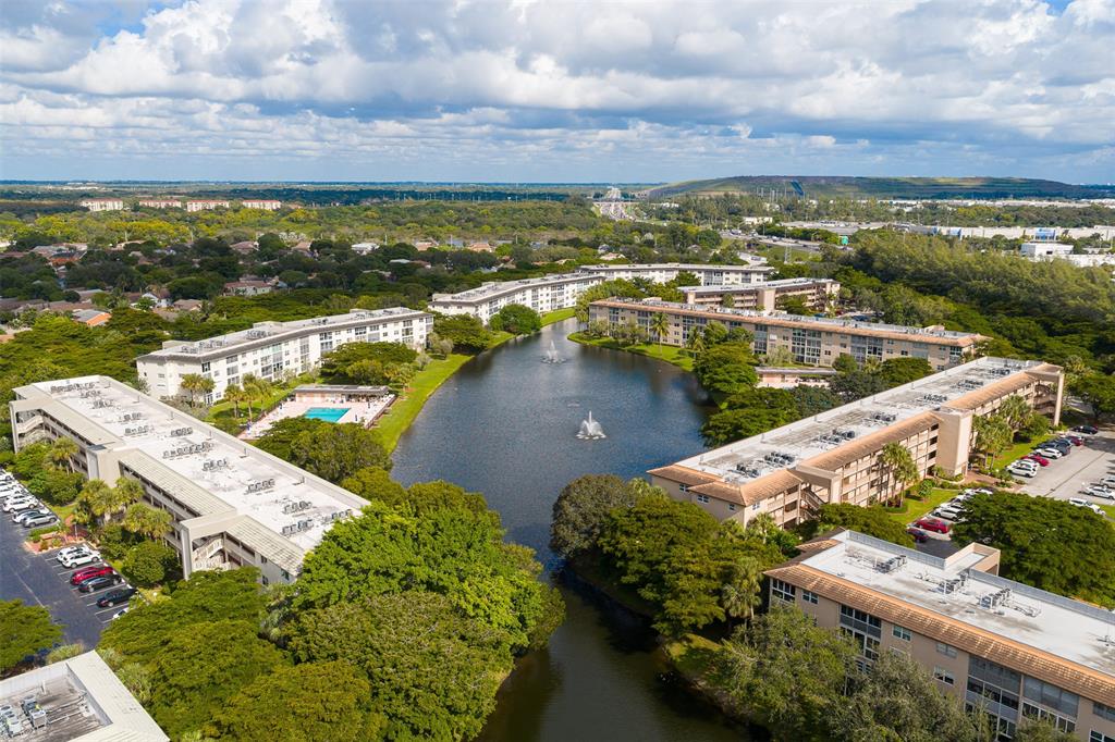 1703 Andros Isle, Unit G4 Coconut Creek, FL 33066 - Photo 28 of 33 an aerial view of a house with a lake view