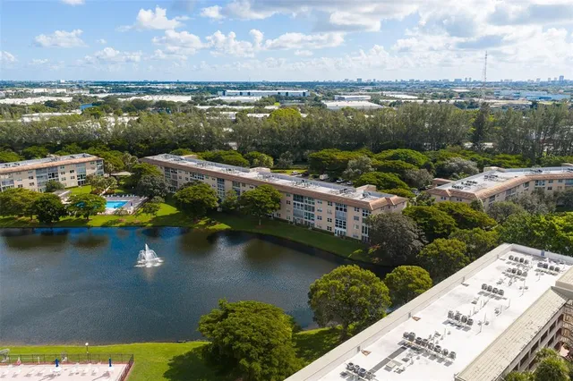 an aerial view of a house with a lake view