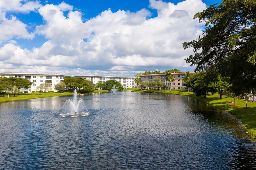 1703 Andros Isle, Unit G4 Coconut Creek, FL 33066 - Photo 32 of 33 a view of a lake