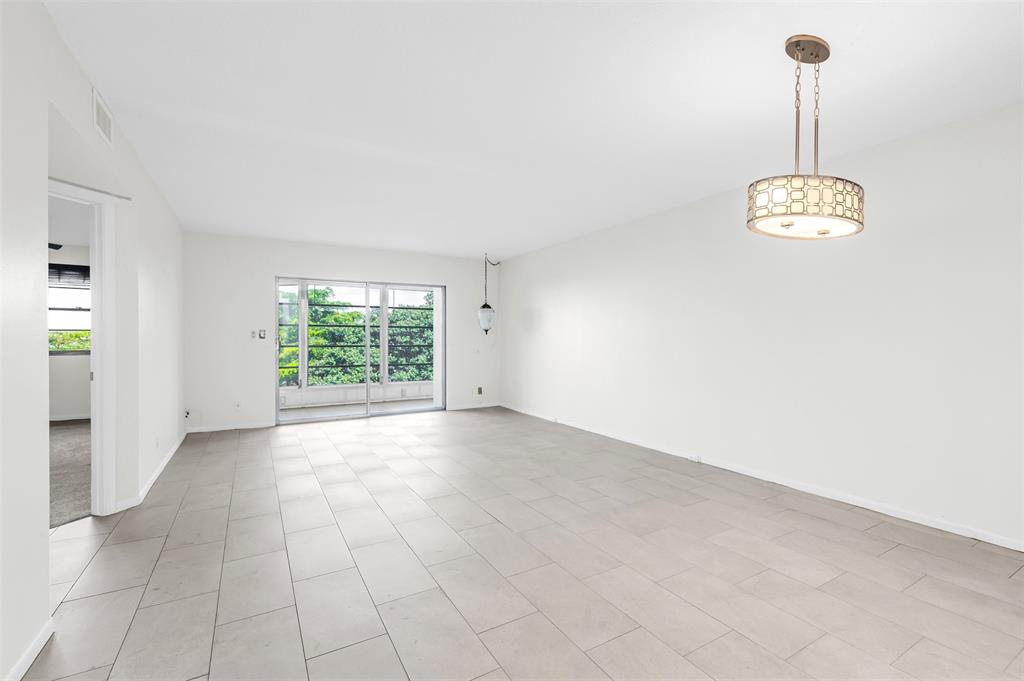 1703 Andros Isle, Unit G4 Coconut Creek, FL 33066 - Photo 6 of 33 a view of an empty room with a window