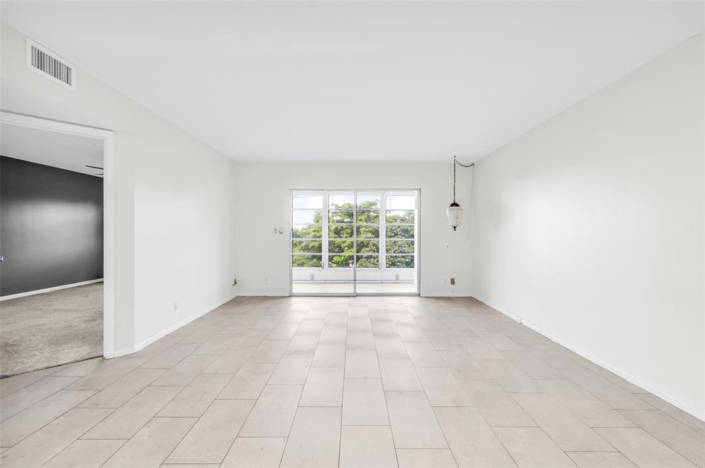 1703 Andros Isle, Unit G4 Coconut Creek, FL 33066 - Photo 7 of 33 an empty room with windows