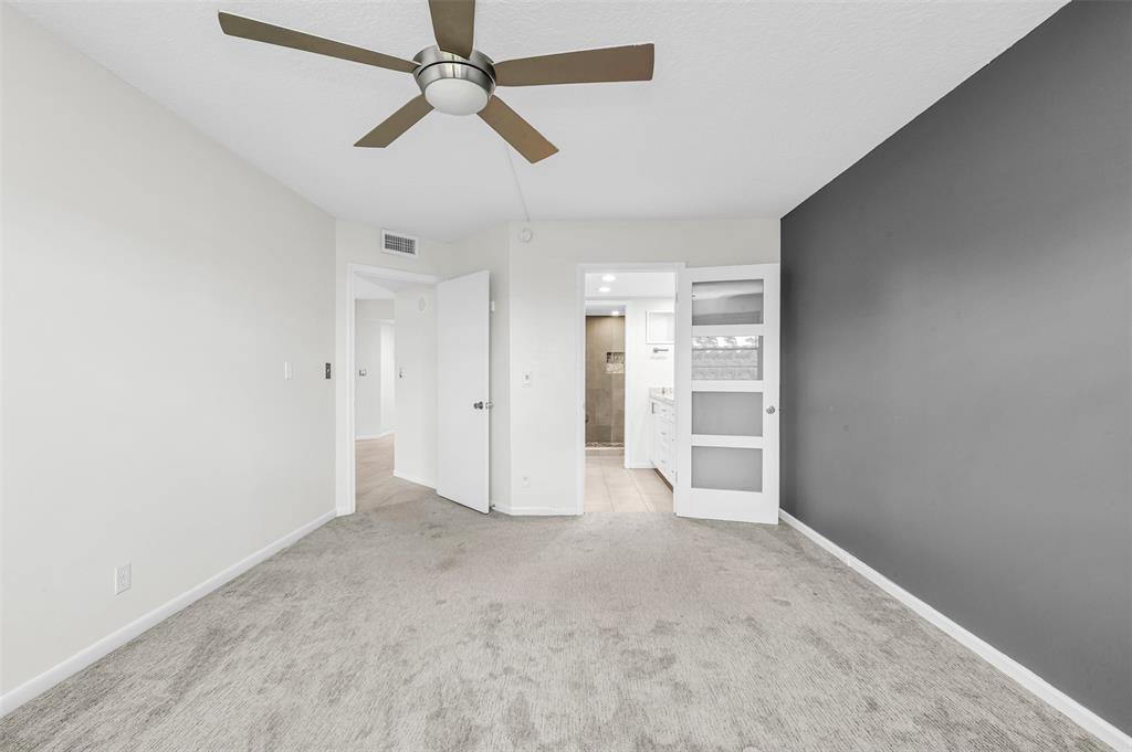 1703 Andros Isle, Unit G4 Coconut Creek, FL 33066 - Photo 9 of 33 an empty room with closet and windows