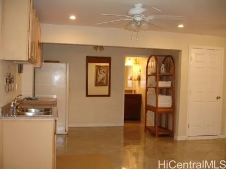 a kitchen with a refrigerator and cabinets