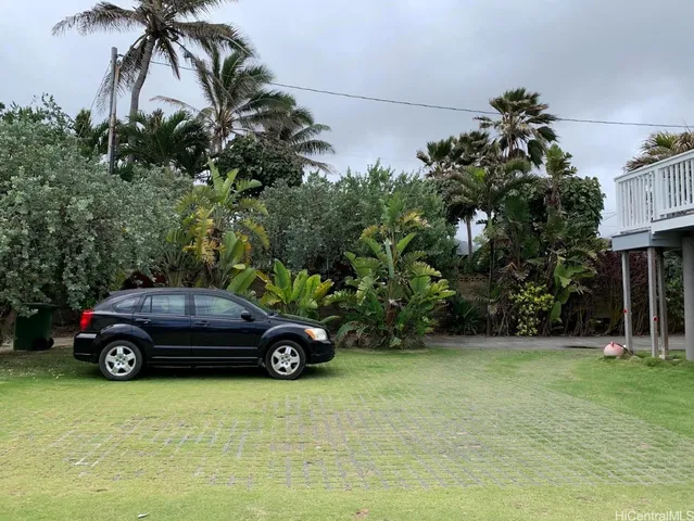 a car parked in the parking lot of a house