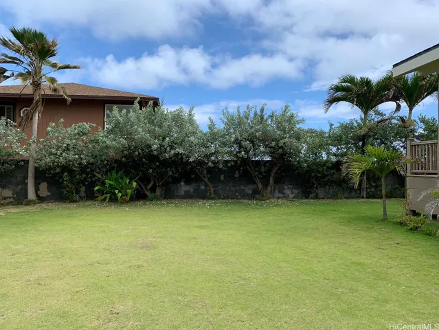 a backyard of a house with lots of green space