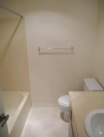 a bathroom with a toilet and a bathtub