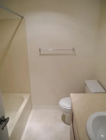 a bathroom with a toilet and a bathtub