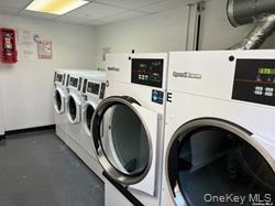 102-12 65th Avenue, Unit 43C Queens, NY 11375 - Photo 13 of 15 a utility room with dryer and washer