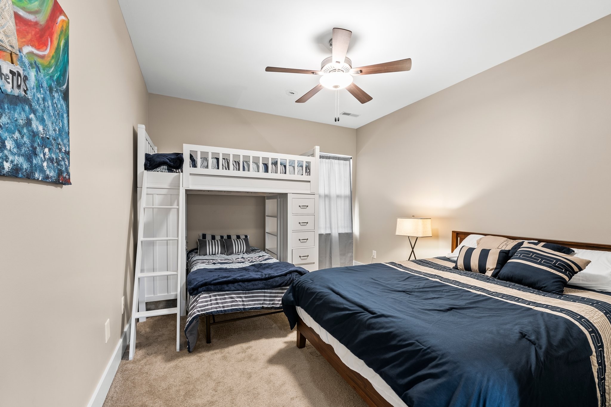 105 Island Way Winchester, TN 37398 - Photo 33 of 41 a bedroom with a bed and a chandelier