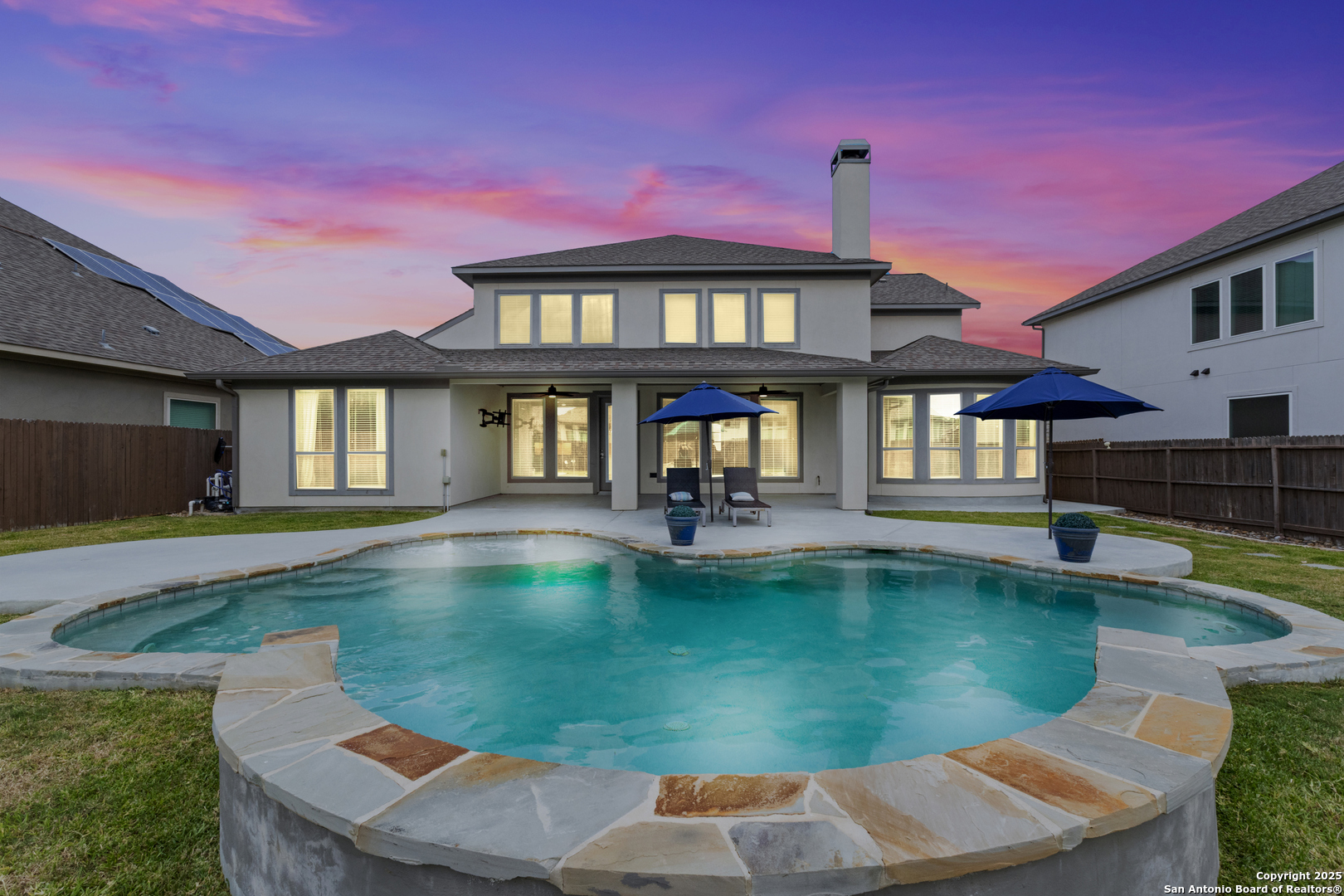 a view of a house with swimming pool