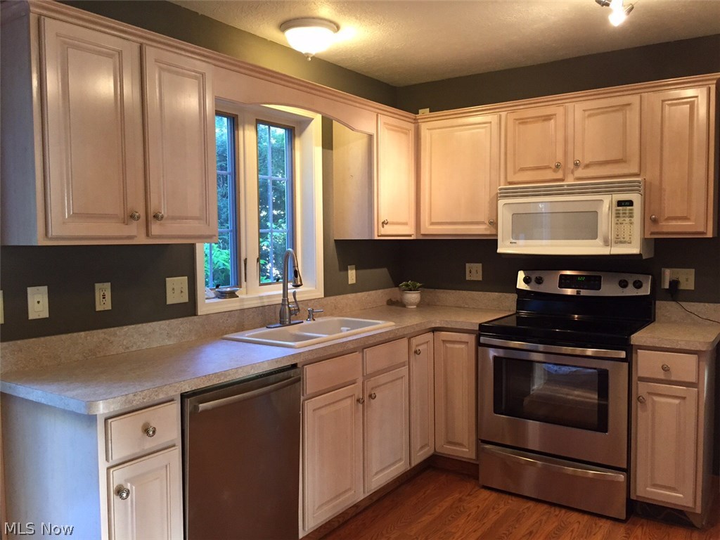 9573 Fair Road Strongsville, OH 44149 - Photo 2 of 16 Lots of counter and cupboard space in this beautiful kitchen.