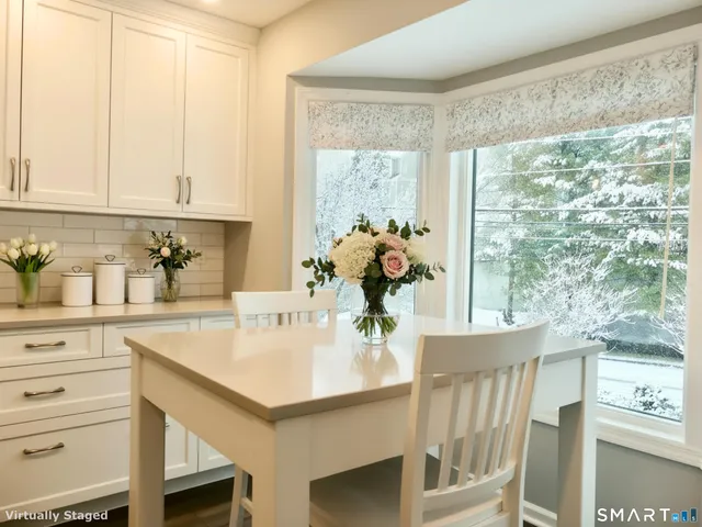 a kitchen with a sink and a large window