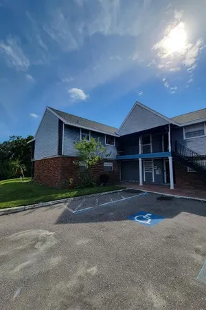 a front view of a house with a yard and a garage