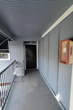 a view of an empty room and fire place