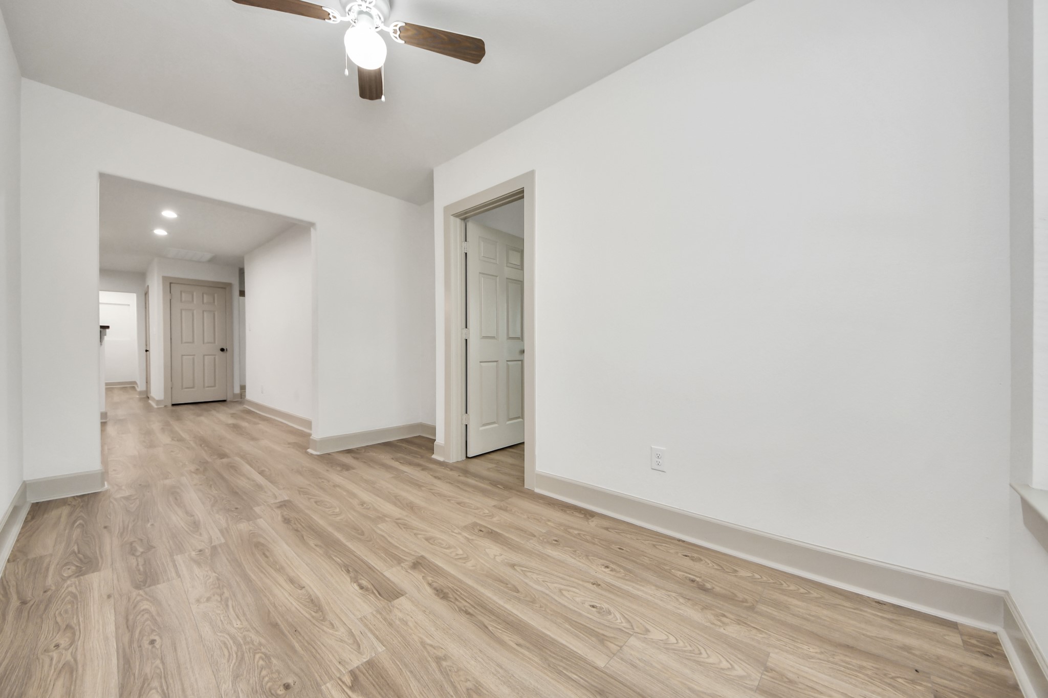 2919 Rosedale Street, Unit B Houston, TX 77004 - Photo 9 of 35 a view of an empty room with wooden floor