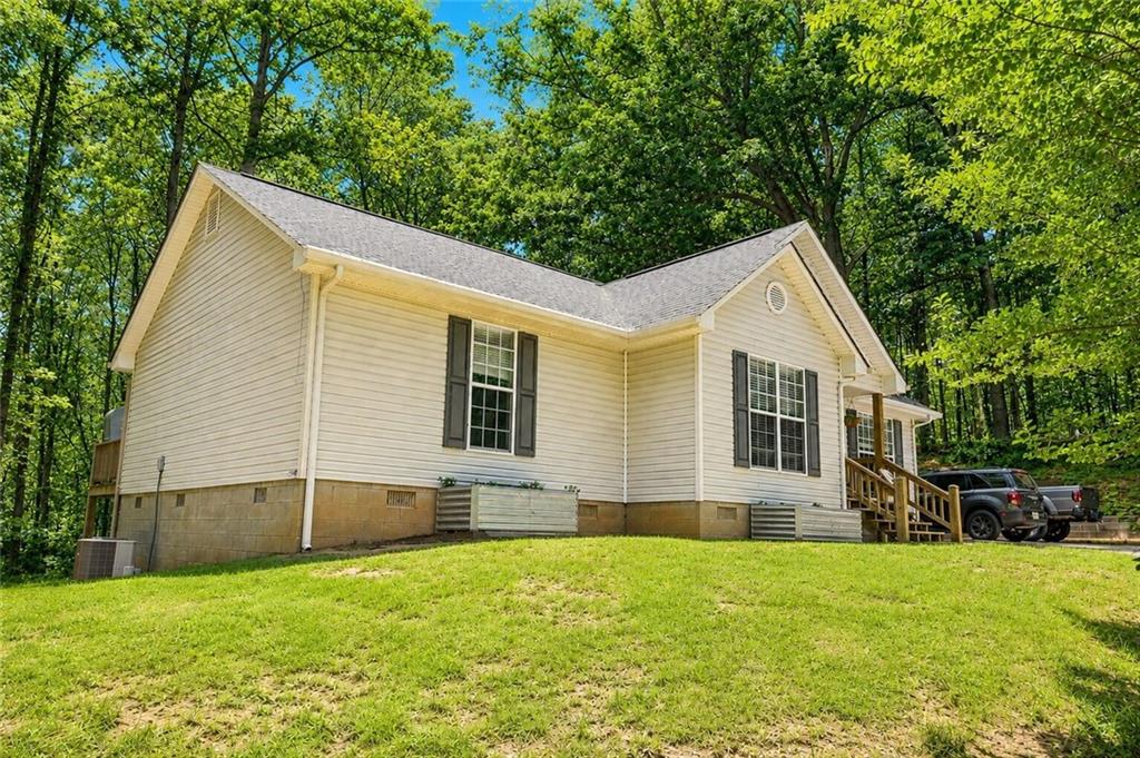 2033 Carson Segars Road Maysville, GA 30558 - Photo 6 of 41 a view of a house with a backyard