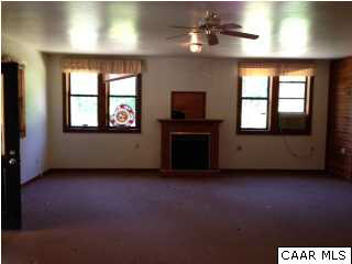 5572 Frank Tate Road Charlottesville, VA 22903 - Photo 8 of 14 a view of an empty room with a fireplace and a window