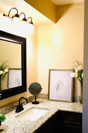 a view of a workspace room with a large window