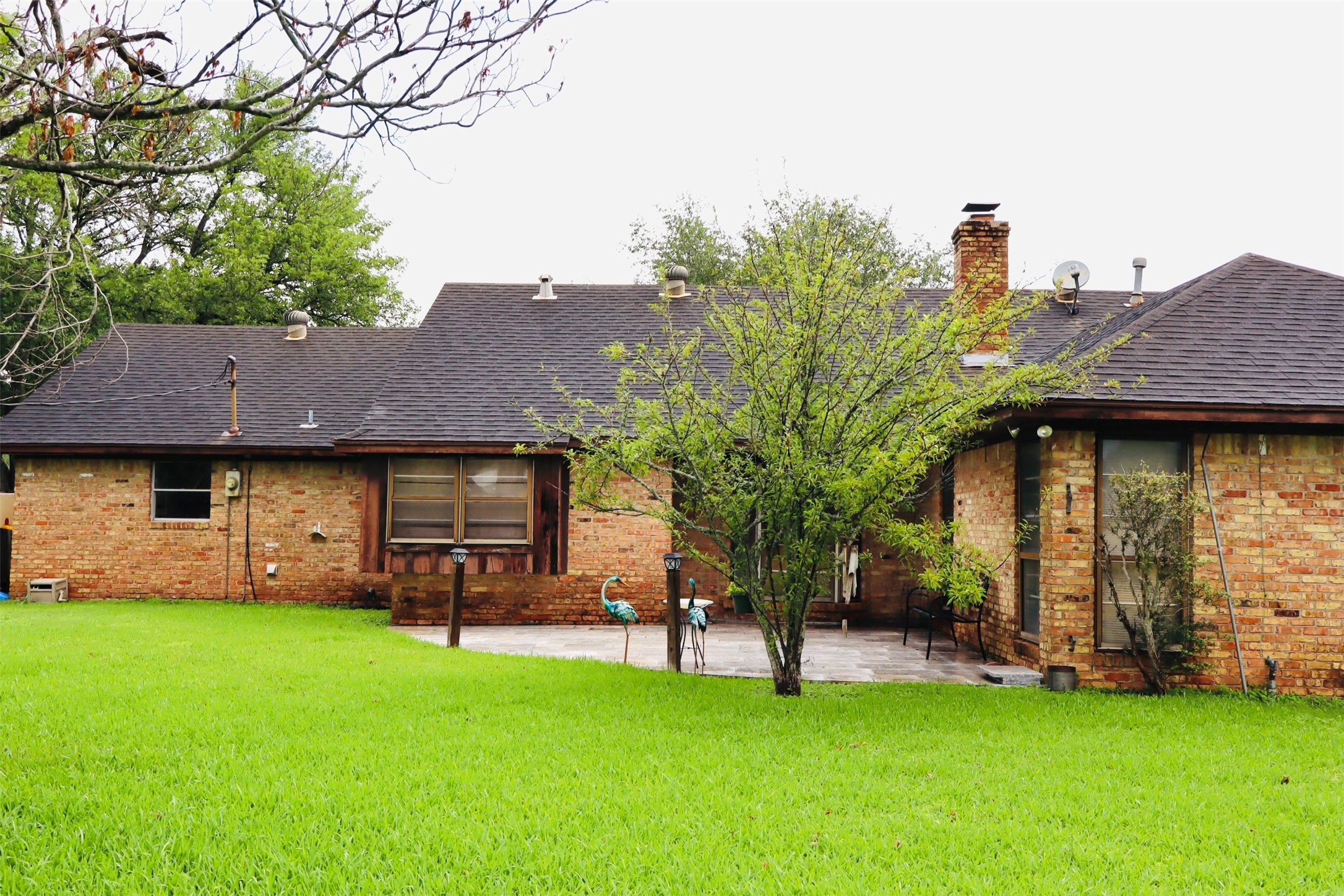 1108 Easy Street Rosenberg, TX 77471 - Photo 22 of 28 a view of a house with backyard and a tree