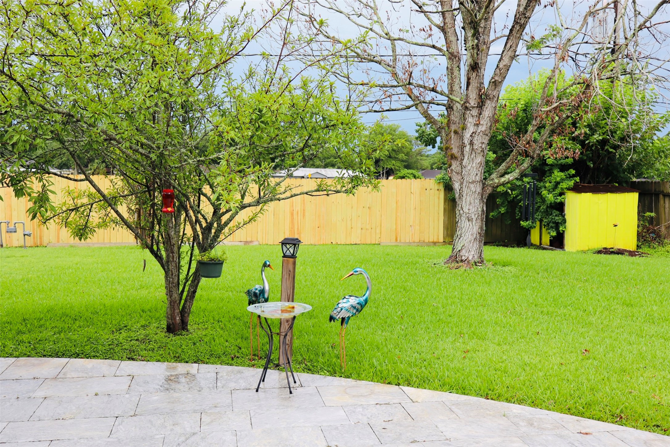1108 Easy Street Rosenberg, TX 77471 - Photo 26 of 28 a view of a garden with a tree