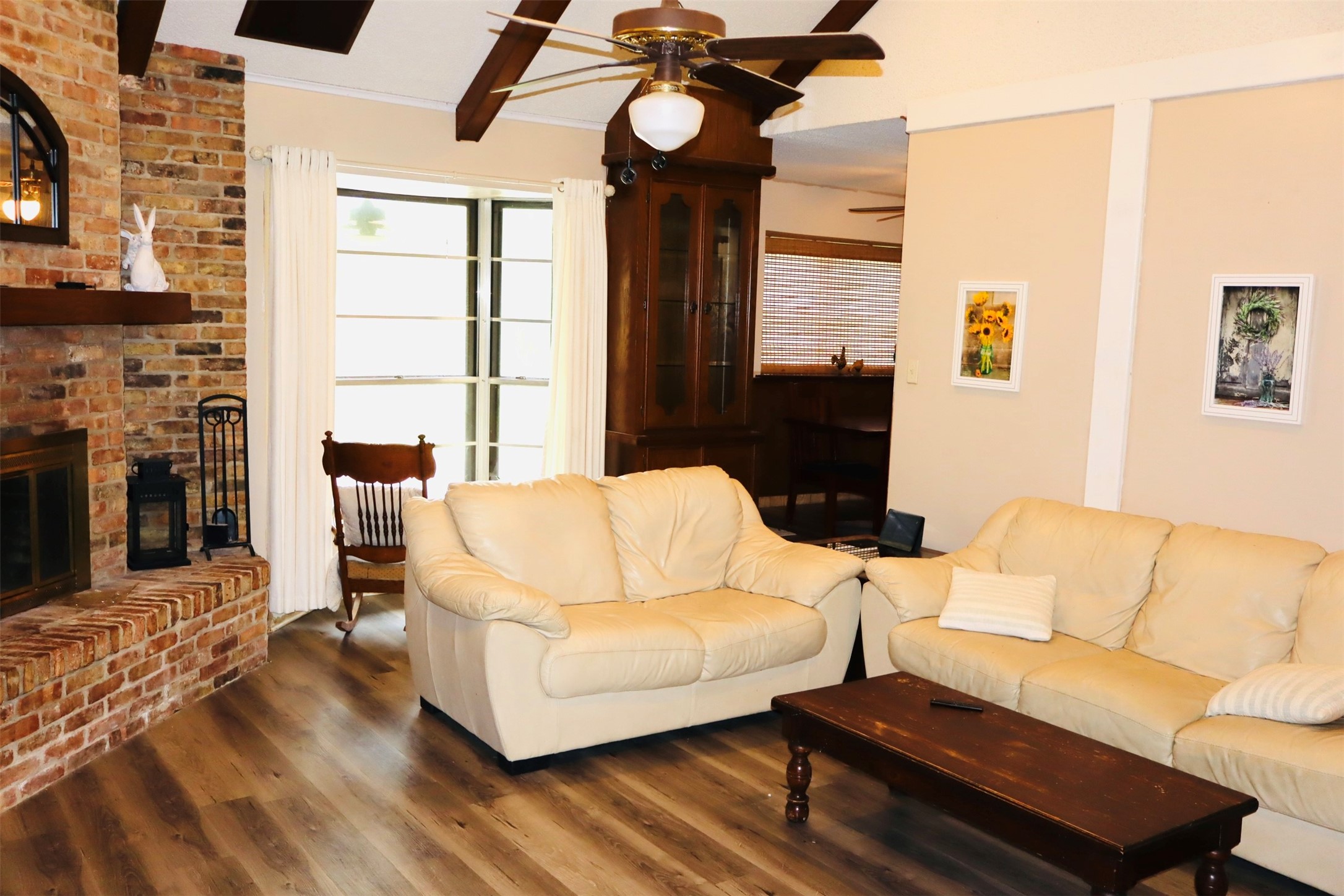 1108 Easy Street Rosenberg, TX 77471 - Photo 4 of 28 a living room with furniture a fireplace and a flat screen tv