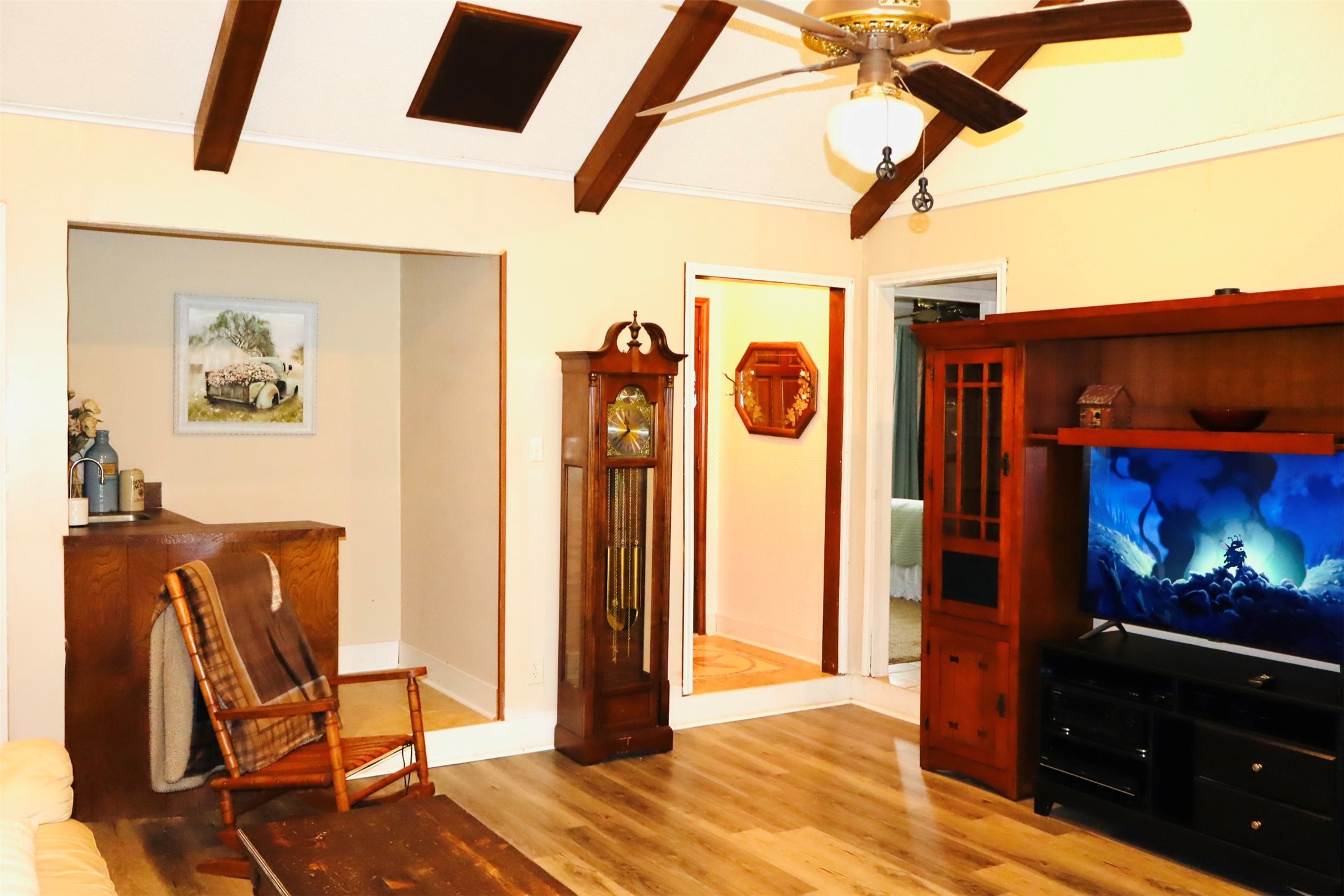 1108 Easy Street Rosenberg, TX 77471 - Photo 5 of 28 a view of a hallway with wooden floor and furniture