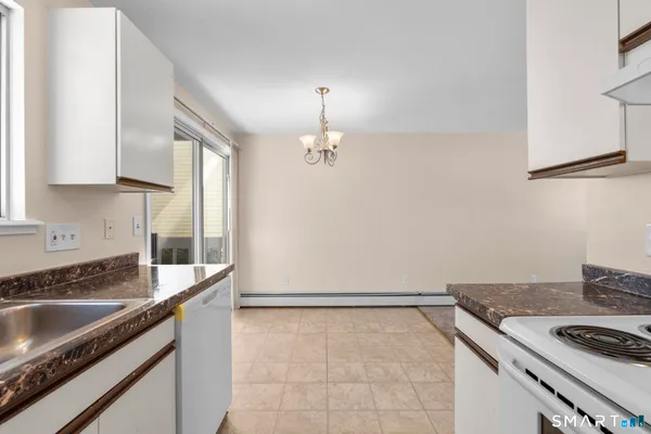 a kitchen that has a sink and a stove