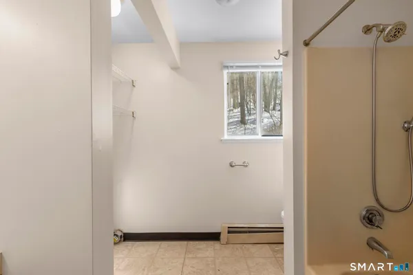 a bathroom with a glass shower door