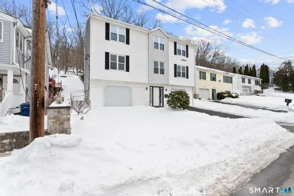 a view of a building with a snow on the road