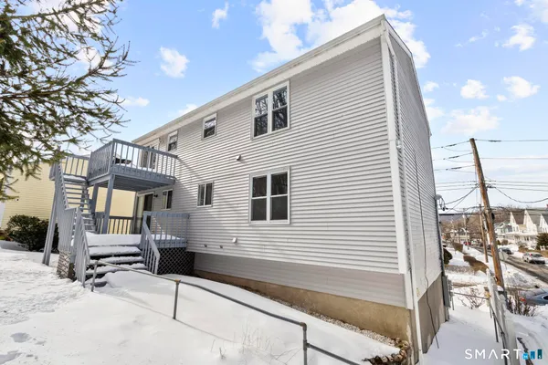 a front view of a house with parking