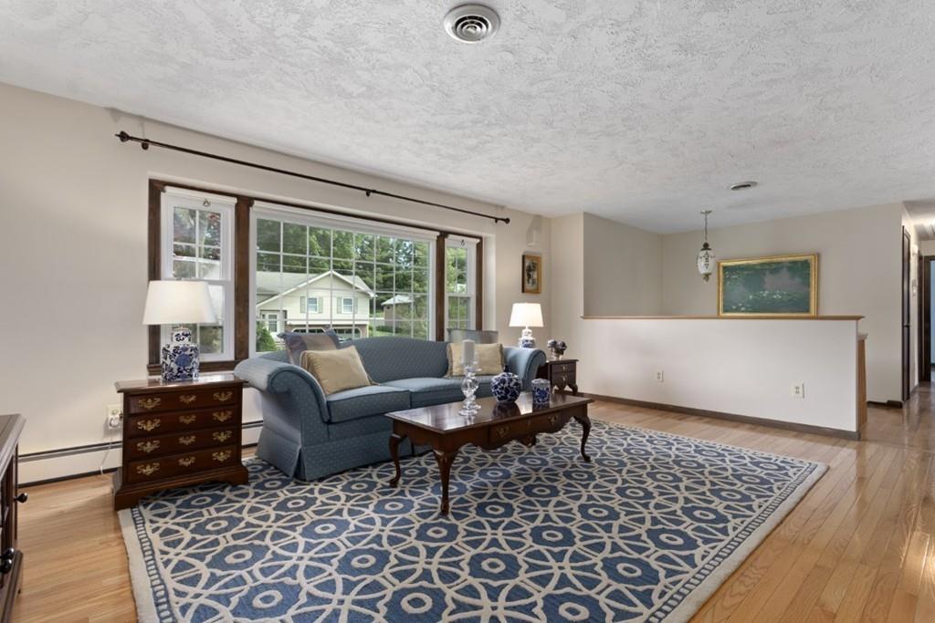 32 Milepost Road Reading, MA 01867 - Photo 5 of 36 a living room with furniture and a window