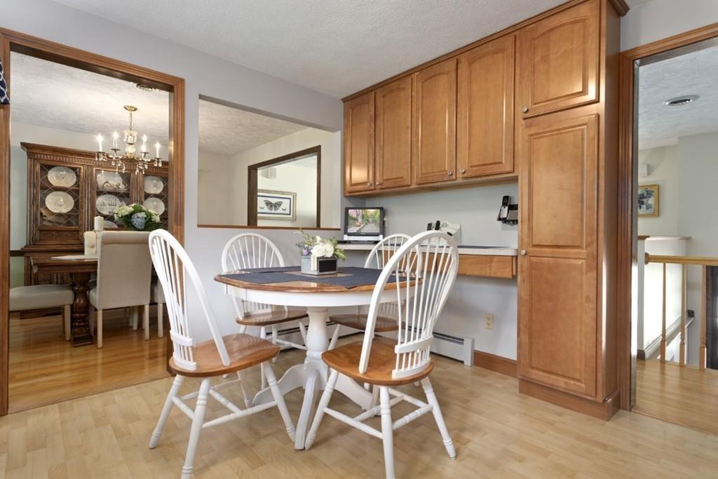 32 Milepost Road Reading, MA 01867 - Photo 9 of 36 a view of a dining room with furniture and wooden floor