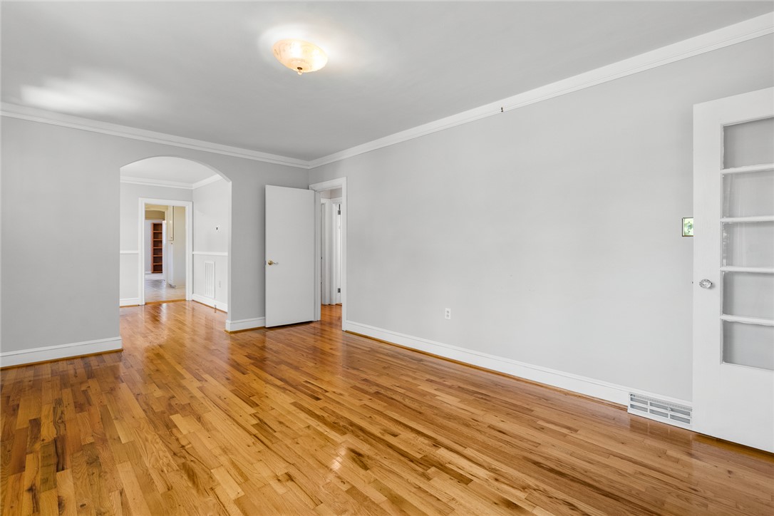 1509 869 Anderson, SC 29621 - Photo 9 of 45 Refined wood floors span a versatile living space, perfect for any design vision.
