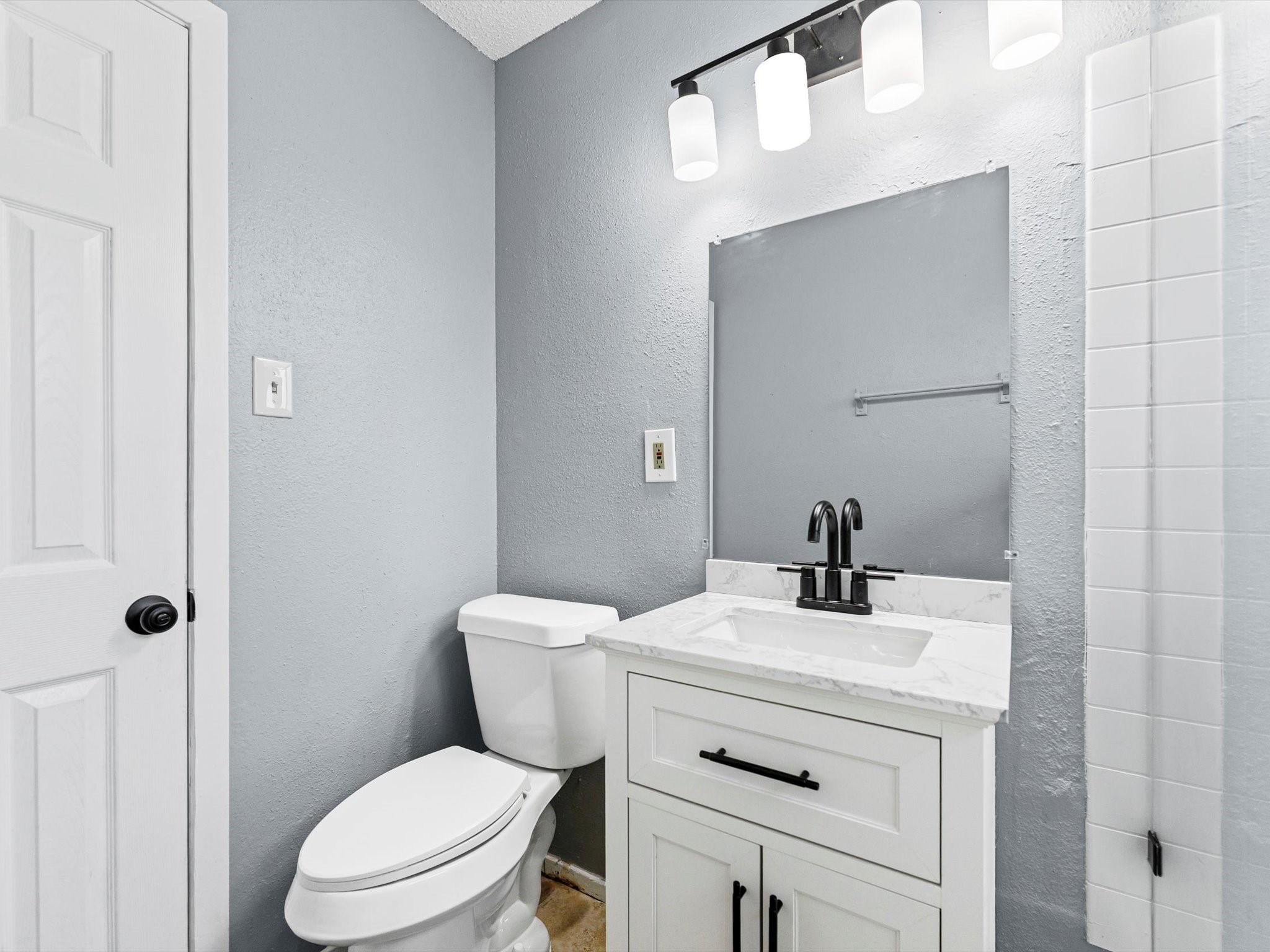 10918 Ritow Street Houston, TX 77089 - Photo 16 of 26 a bathroom with a sink a toilet and mirror