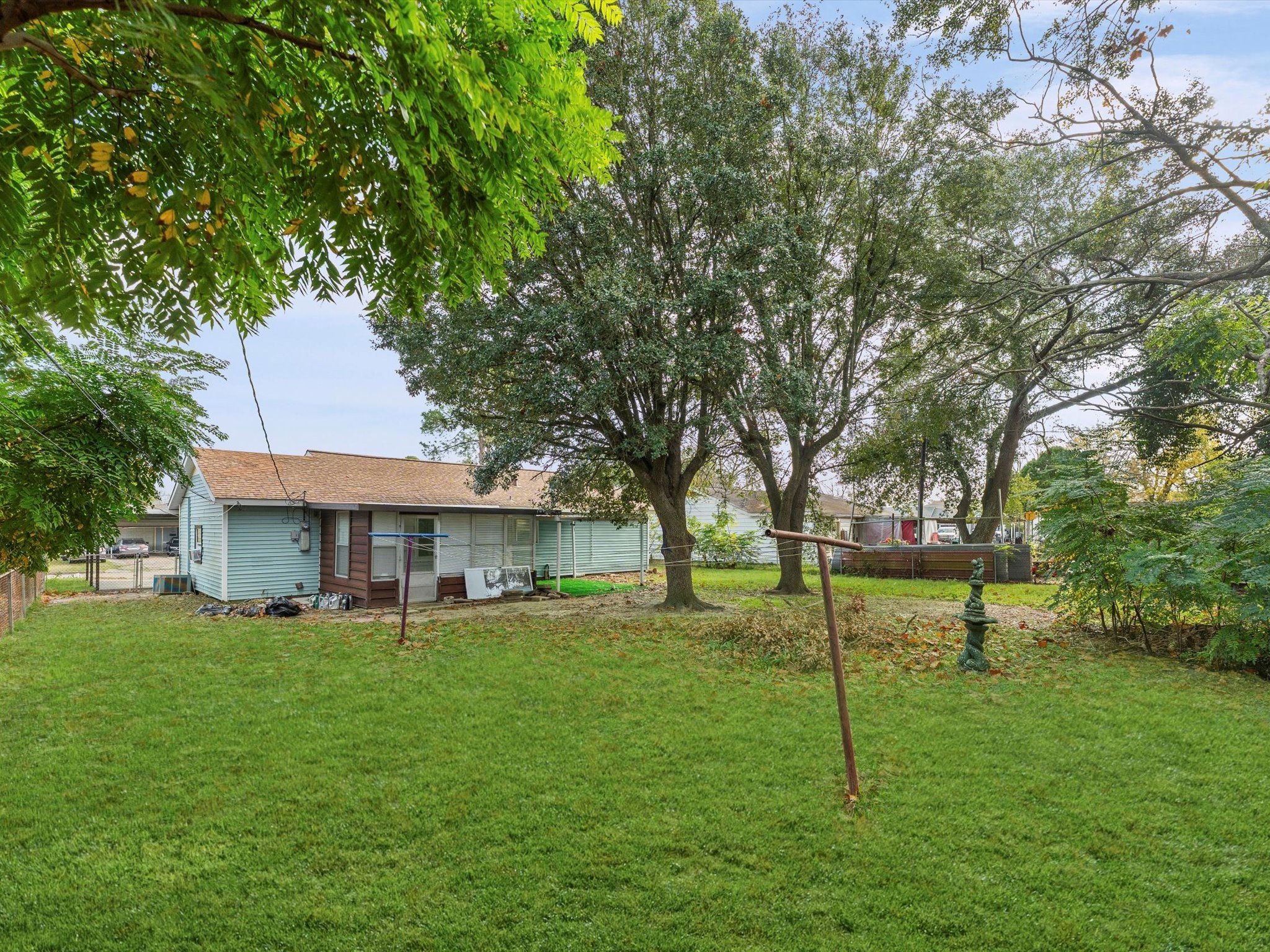 10918 Ritow Street Houston, TX 77089 - Photo 24 of 26 a view of a house with a yard