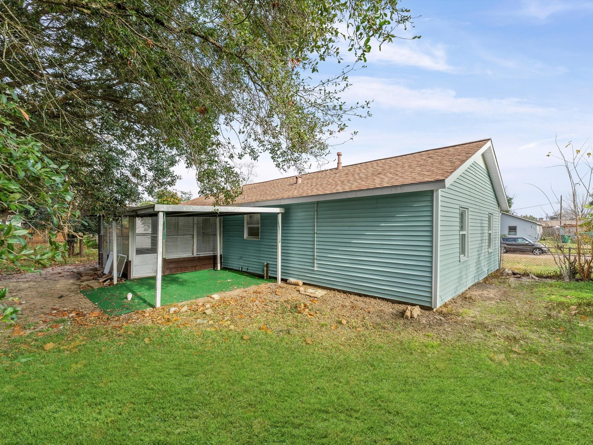 10918 Ritow Street Houston, TX 77089 - Photo 26 of 26 a view of a house with a yard and large tree