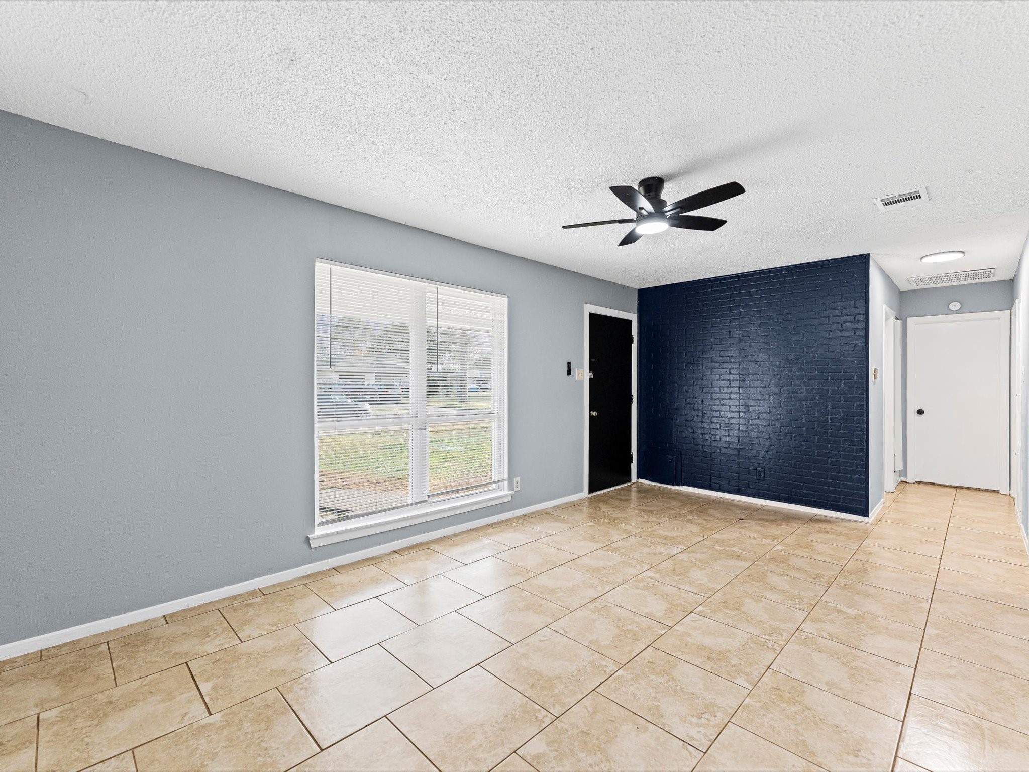 10918 Ritow Street Houston, TX 77089 - Photo 4 of 26 a view of an empty room with a window