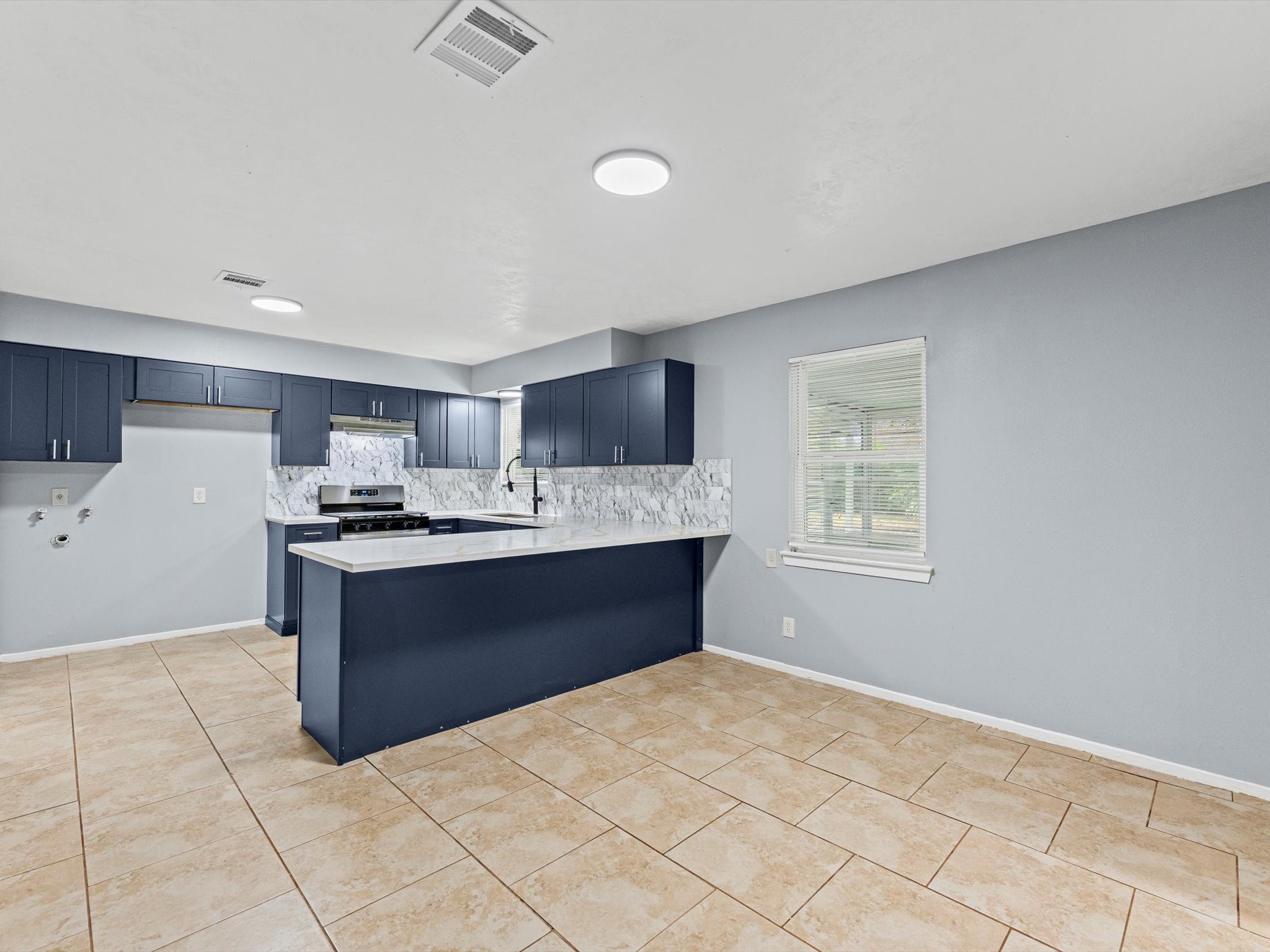 10918 Ritow Street Houston, TX 77089 - Photo 5 of 26 a kitchen with stainless steel appliances kitchen island granite countertop a refrigerator sink and cabinets