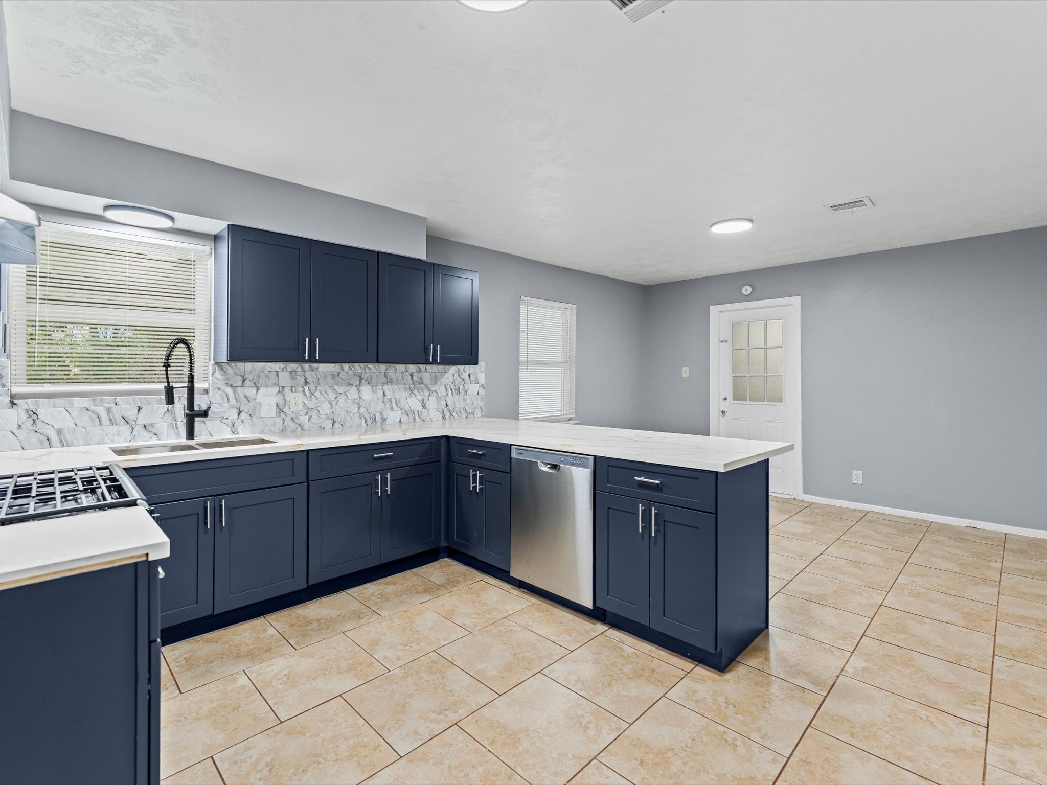 10918 Ritow Street Houston, TX 77089 - Photo 7 of 26 a kitchen with stainless steel appliances granite countertop a sink stove and cabinets