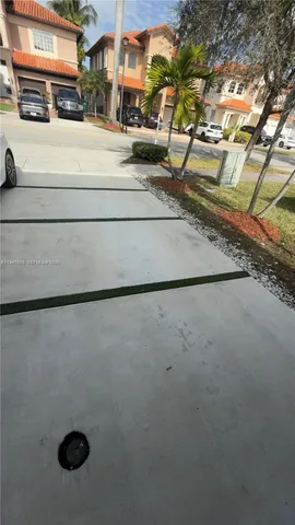 a view of a house with a street
