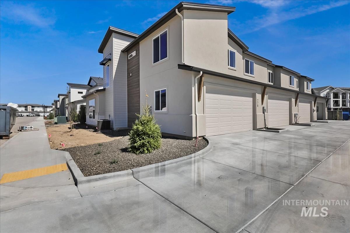 776 South Calhoun Lane Star, ID 83669 - Photo 43 of 49 Modern townhome exterior featuring stucco and vertical siding accents