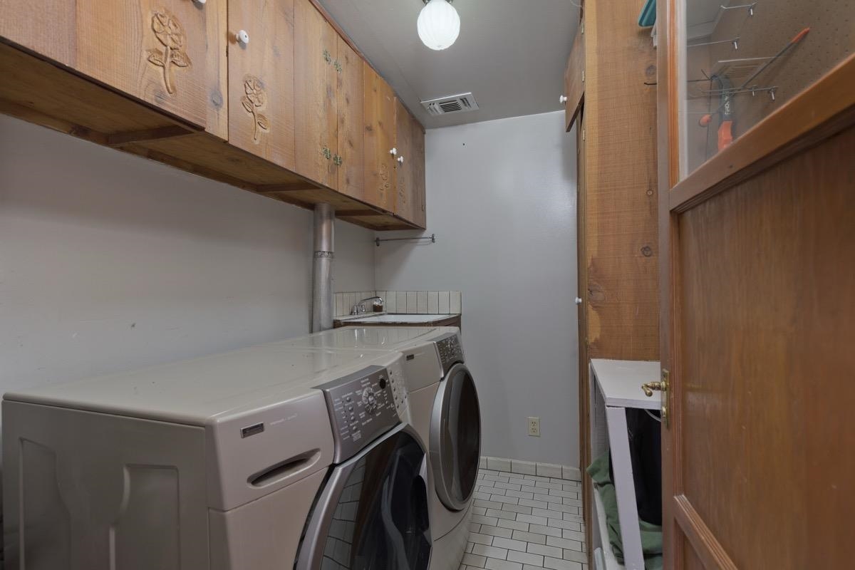 2030 Old Mammoth Road Mammoth Lakes, CA 93546 - Photo 24 of 46 a view of a storage and utility room with a washer dryer