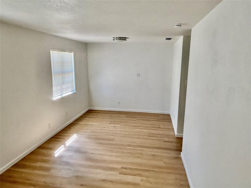 607 Baylor Street Nocona, TX 76255 - Photo 13 of 17 a view of an empty room and window