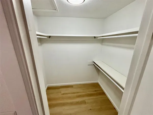 a view of a room with racks on the wall