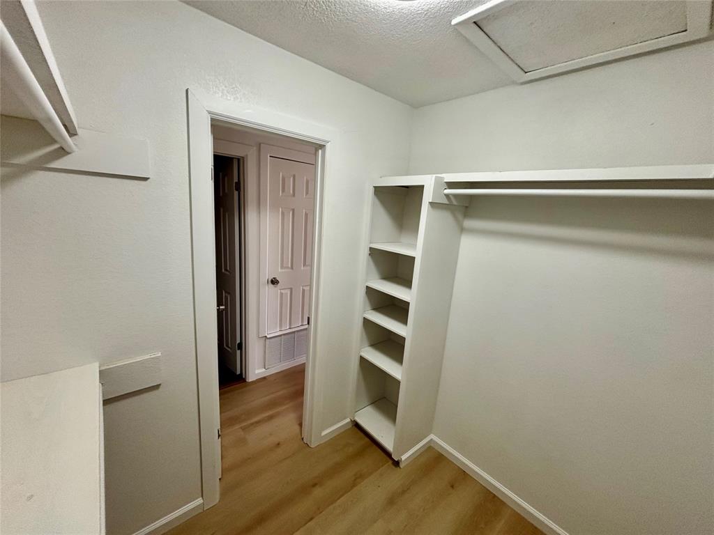 607 Baylor Street Nocona, TX 76255 - Photo 16 of 17 a view of walk in closet with empty racks